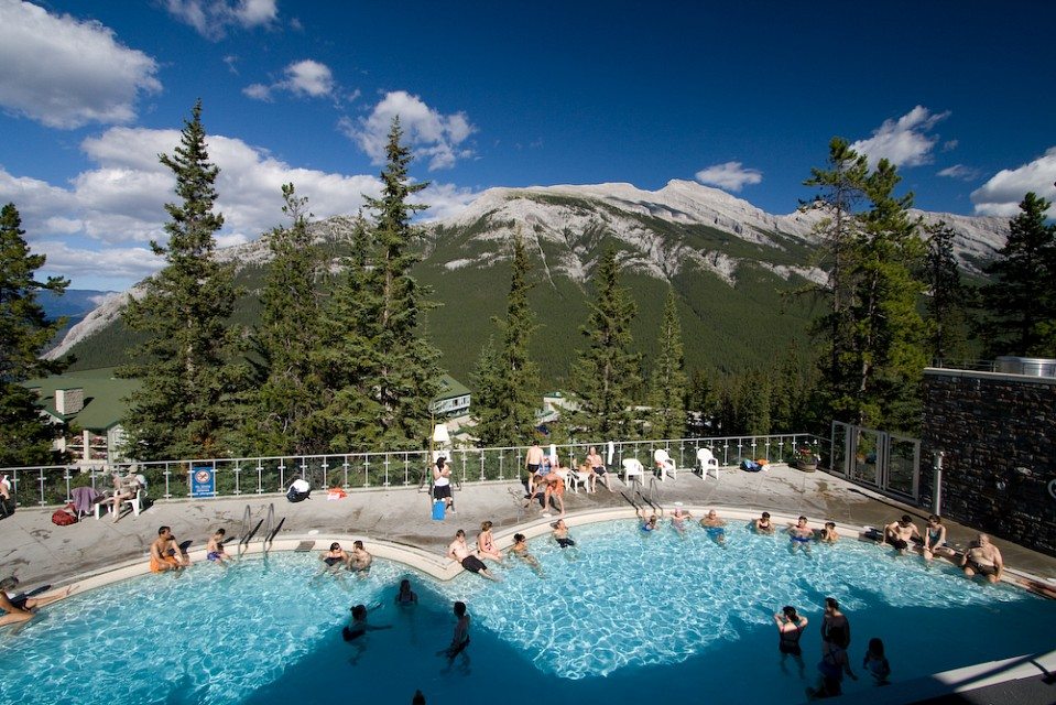 Amazing mountain views surround the steaming Banff Upper Hot Springs in the summer